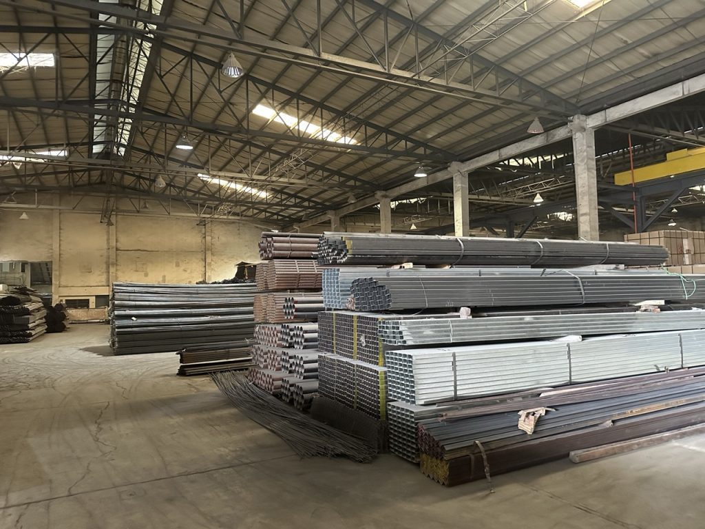 Steel bars and angle stock stacked in the warehouse
